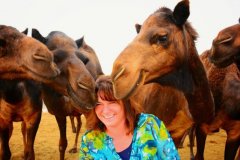 This is our Nevada Coordinator, Teri Koehler, having fun with some friendly camels while on holiday.
